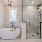 Elegant Bathroom Remodel Featuring Freestanding Tub and Glass Shower
