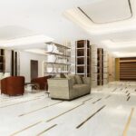 Elegant living room after luxury home renovation with chandelier, marble floors, and custom furniture