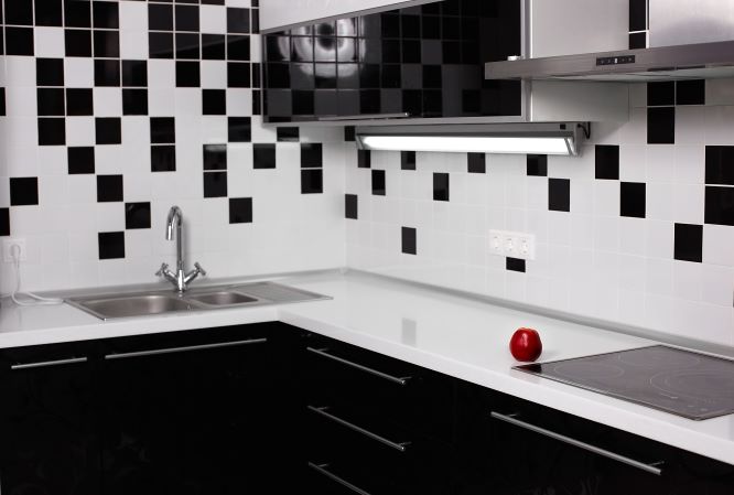 Modern kitchen backsplash with white subway tiles and stainless steel appliances
