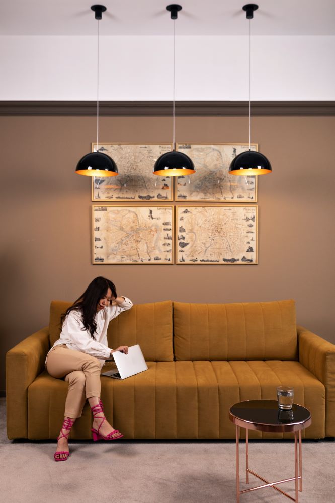 Modern living room with stylish Lumolog ceiling lights and warm ambiance