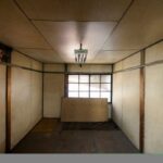 Architectural salvage materials like vintage doors, reclaimed wood beams, and stained glass