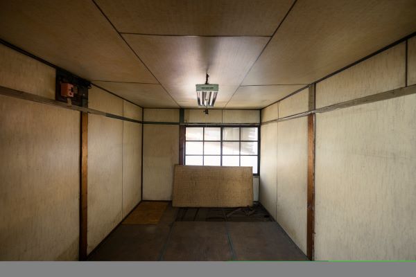 Architectural salvage materials like vintage doors, reclaimed wood beams, and stained glass