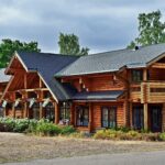 Different types of log homes including full scribe, milled, handcrafted, hybrid, and timber frame styles